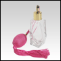 Diamond shaped glass bottle with Pink antique style sprayer top with tassel. Capacity: 2oz 