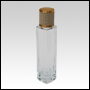 Slim clear glass tall bottle with Ivory Leather-type cap. Capacity: Up to 53 mL  (~1.80 oz) at neck.