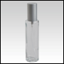 Clear Glass Bottle. Tall, Cylindrical with a Matte Silver Sprayer and Cap. Capacity:1 2/3 oz (50ml)